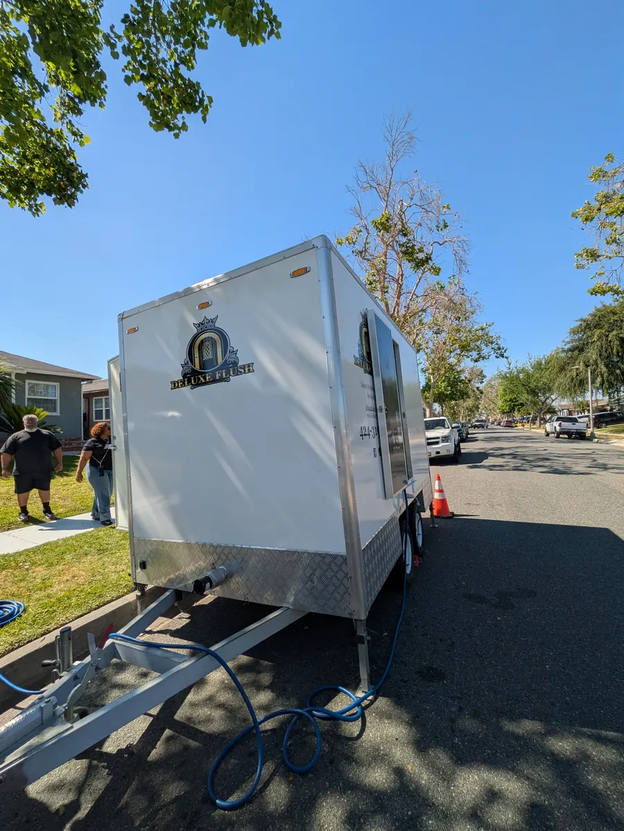 Deluxe Flush trailer being positioned and hooked up on delivery day