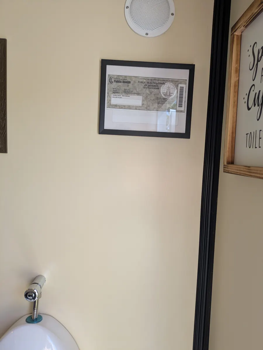 Bright, spotless interior of the climate-controlled Deluxe Flush restroom trailer